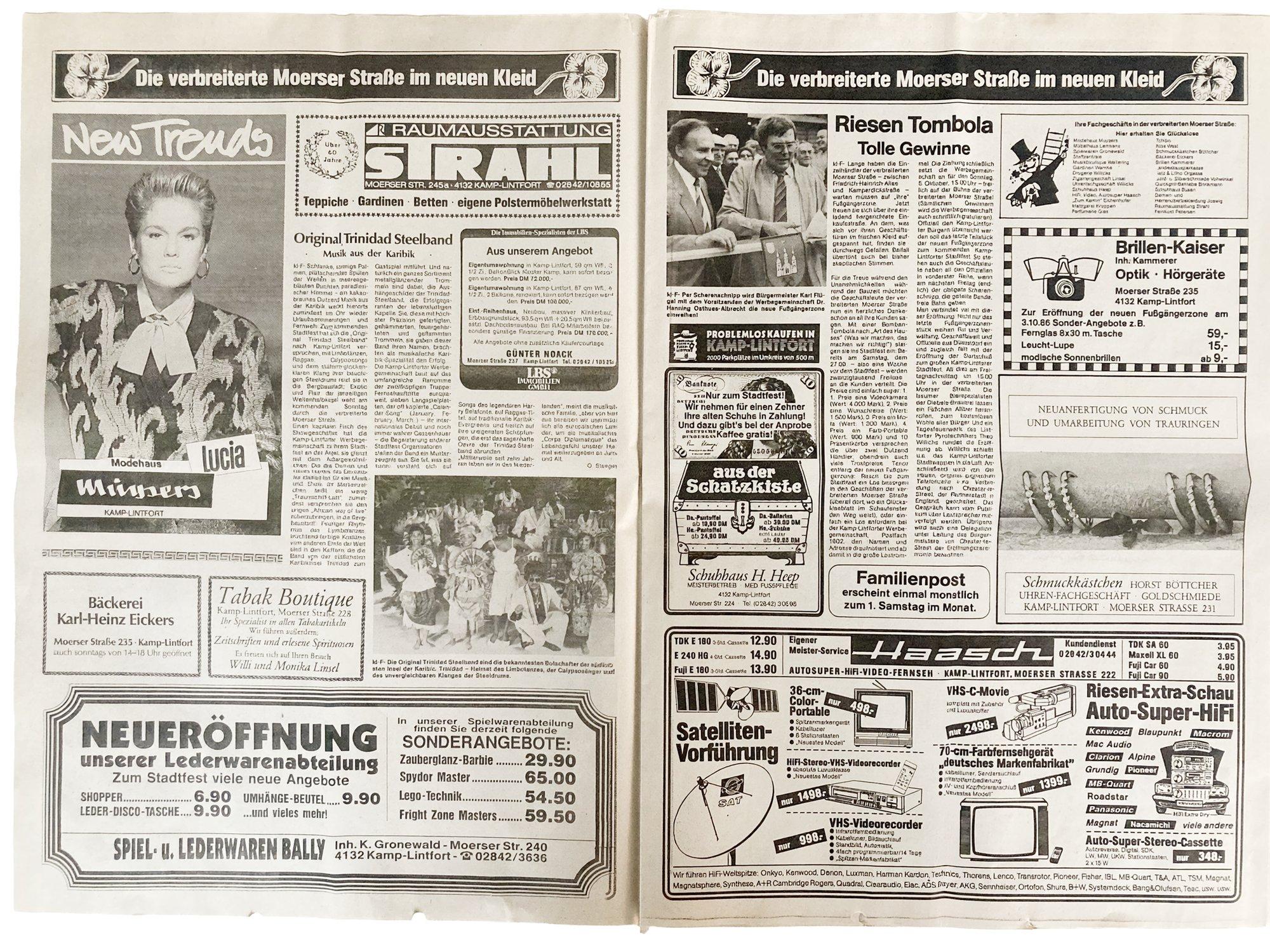 Aufgeschlagene historische Familienpost-Ausgabe mit Anzeigen Kamp-Lintforter Geschäfte
